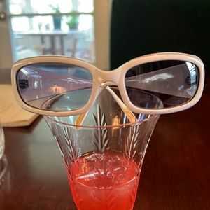 Paul Smith Sunglasses. White frames with black stripe accents.